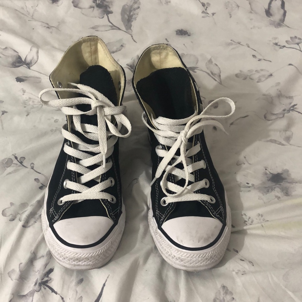 Black high top converse sneakers